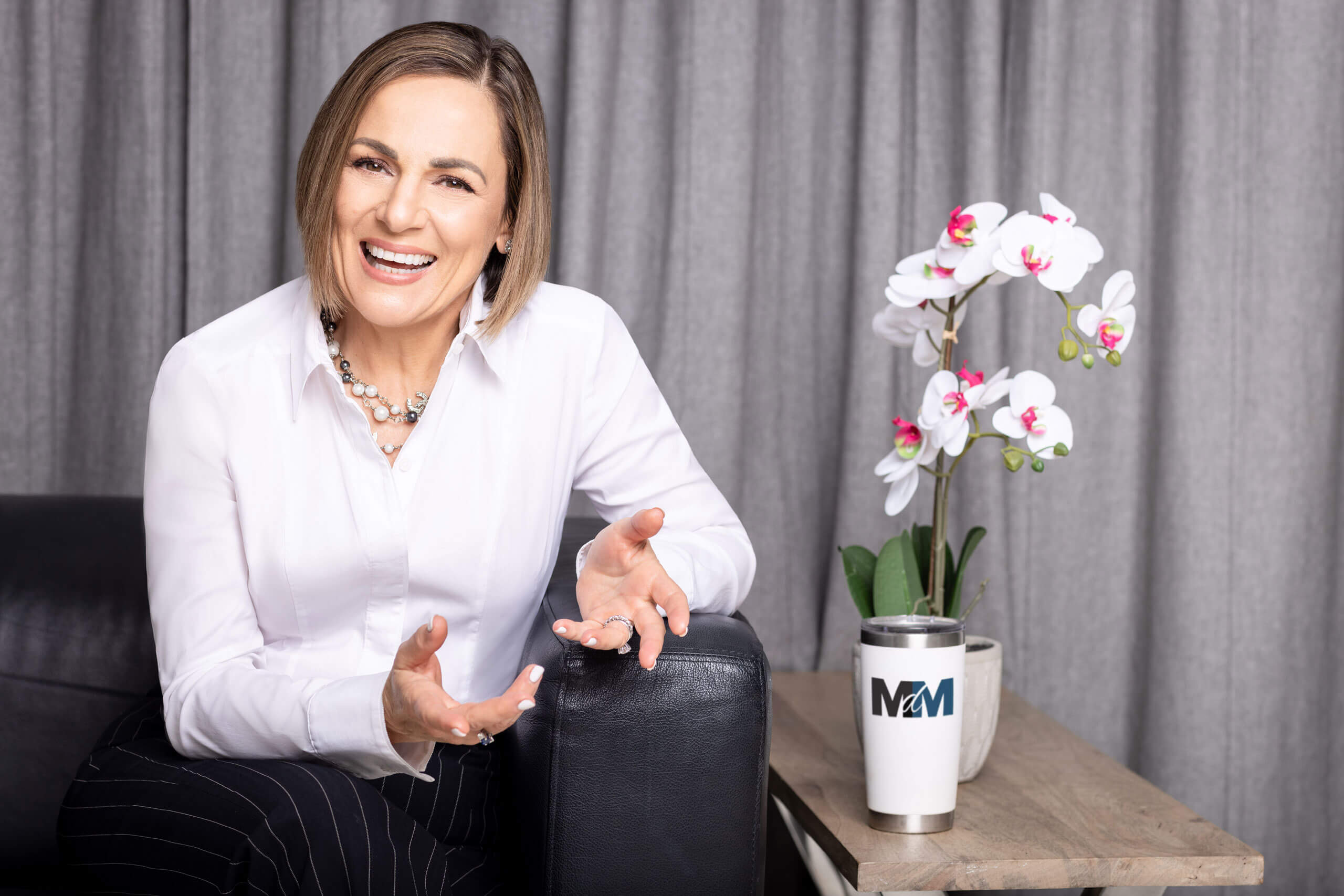 Monique DeMaio on stage at a speaking engagement